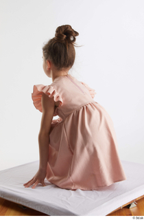 Doroteya  1 casual dressed kneeling pink dress whole body…